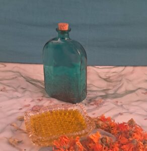 Calendula Infused oil in a green bottle