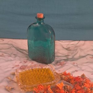 Calendula Infused oil in a green bottle